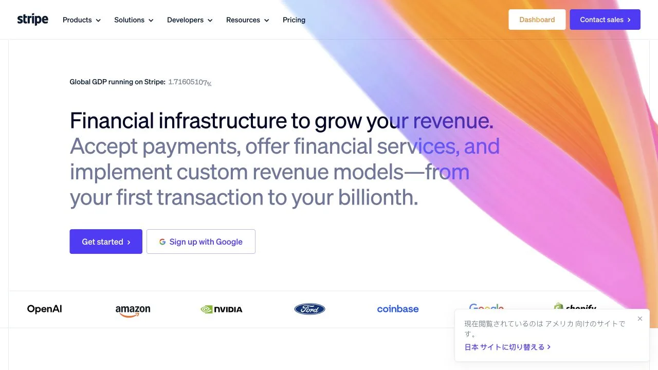 Stripe's English homepage with a multicolor ribbon, left-aligned product message, purple action button, and customer logo row